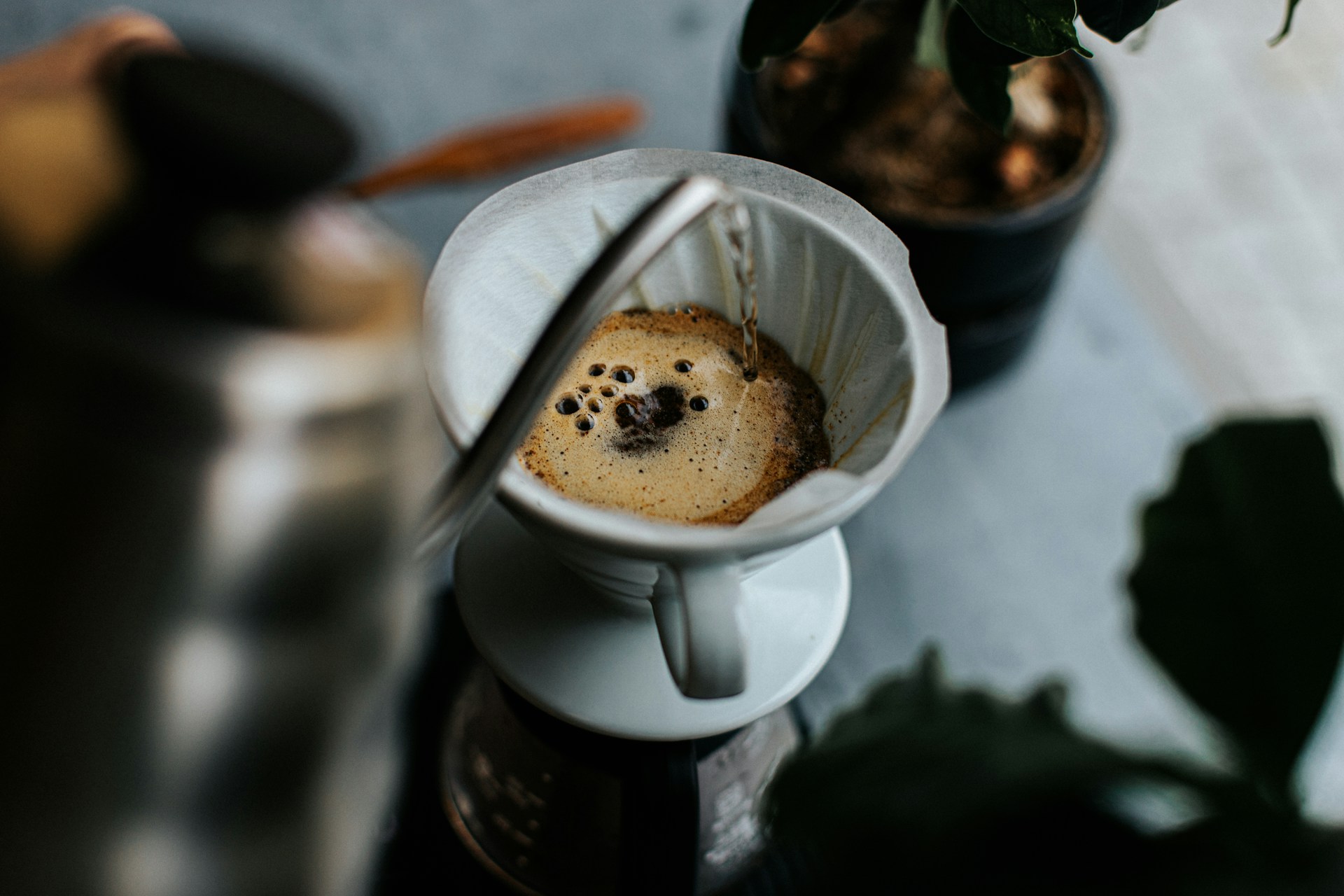 A cup of coffee being poured